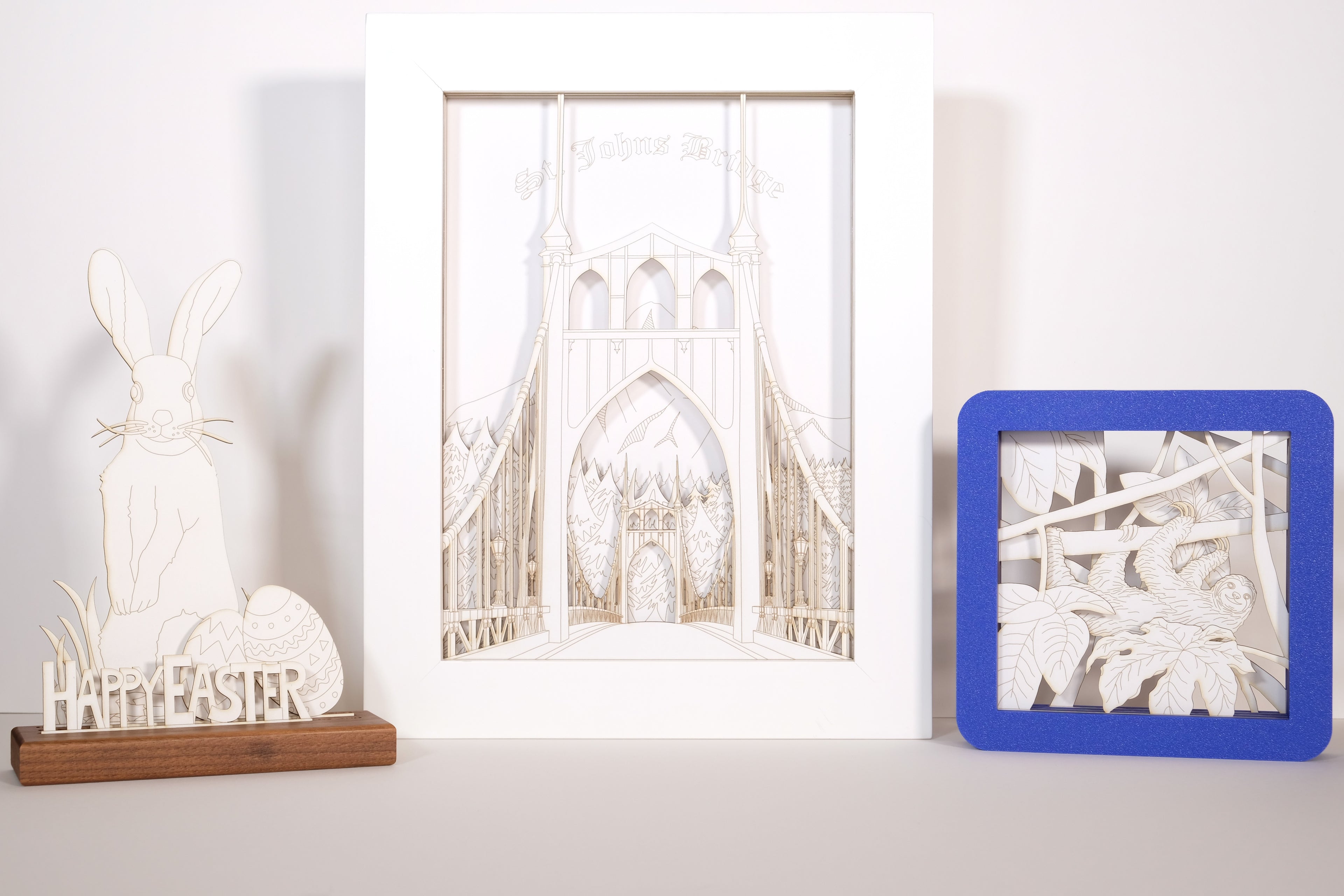 Decorative papercut art pieces on a white surface